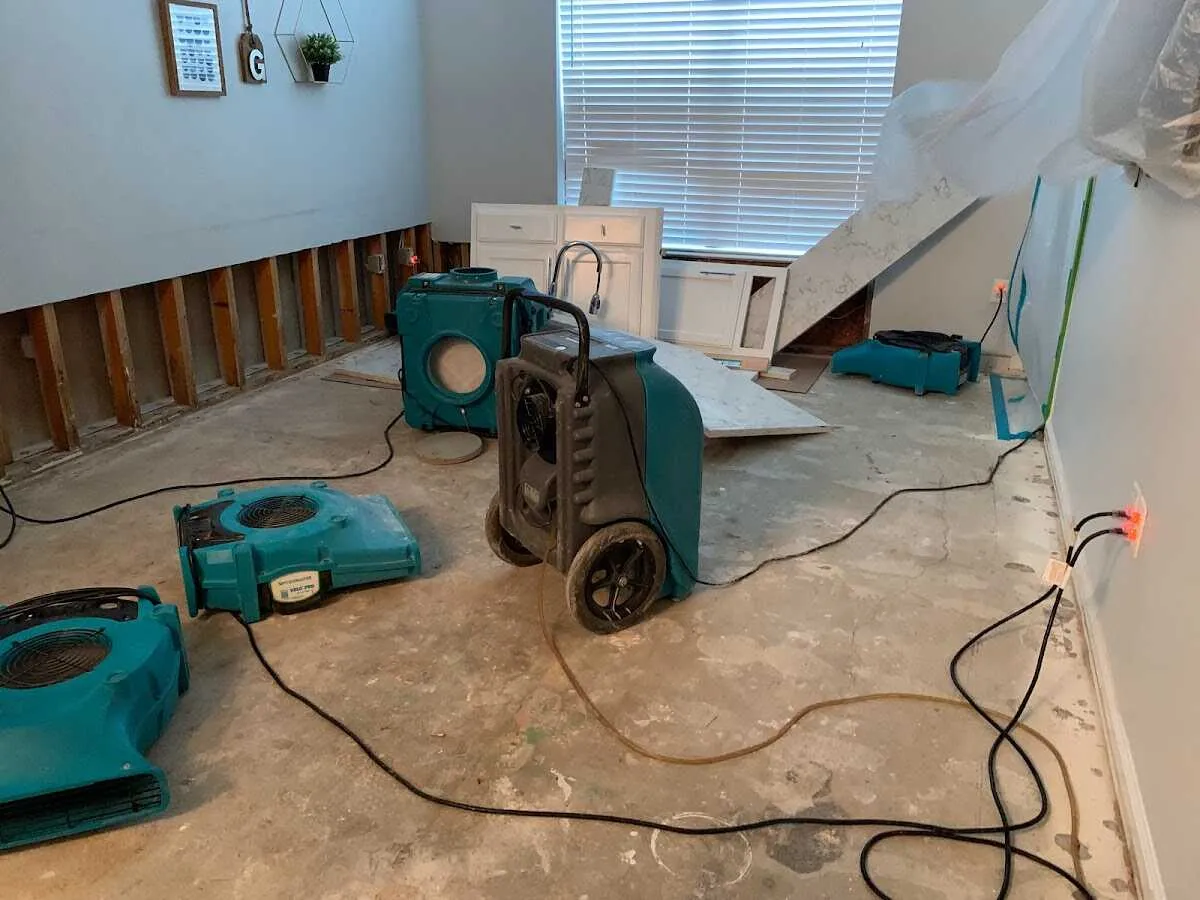 Dehumidifier in flood-cut room for Water Damage Restoration in Ashburnham